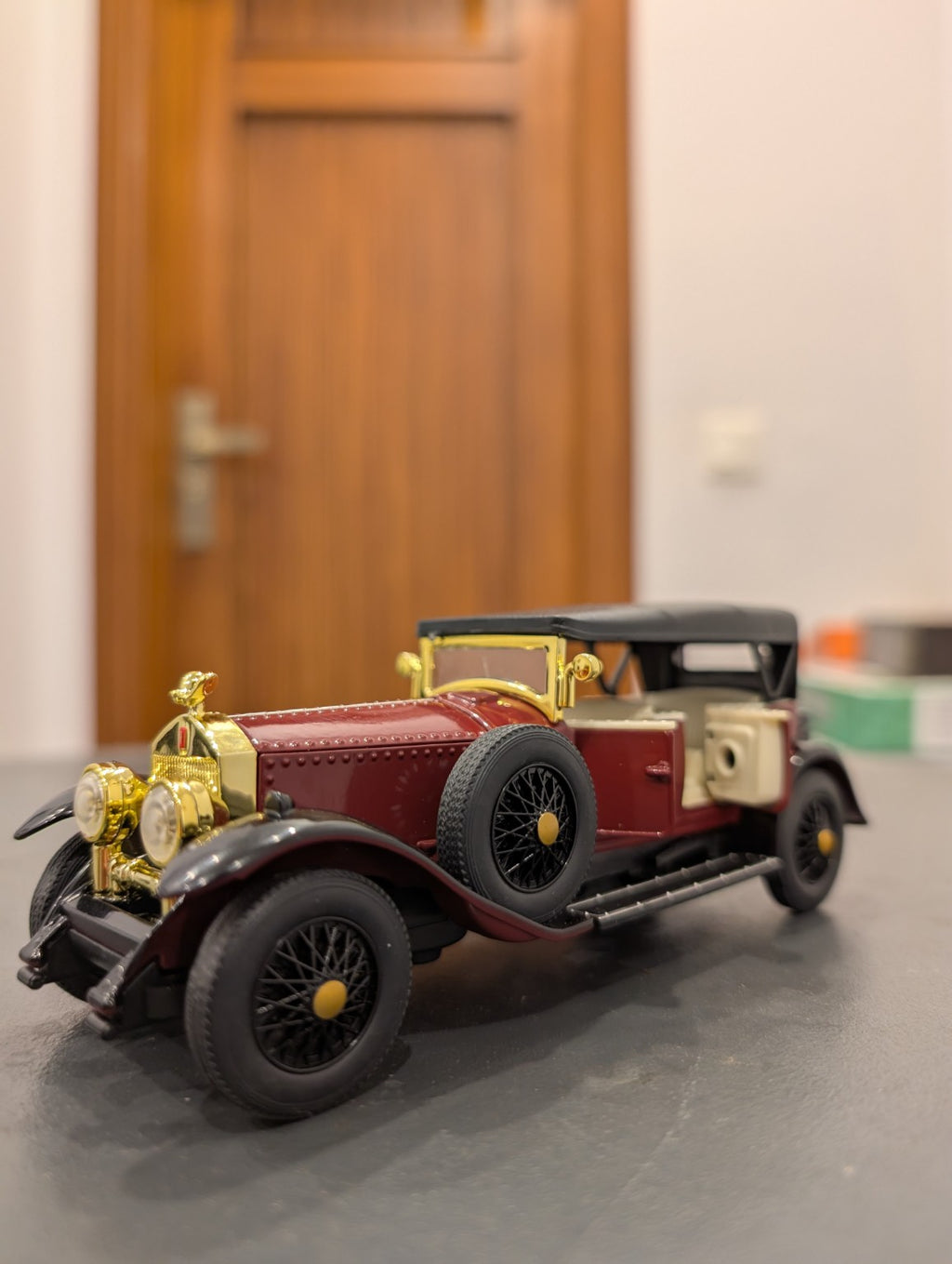 Burgundy 1:32 vintage diecast model car, close-up details