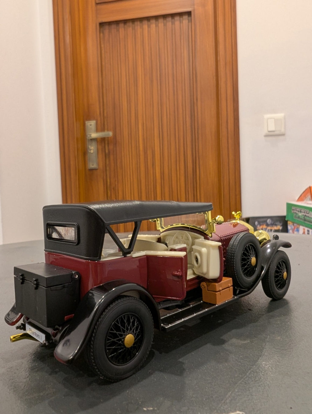 Burgundy 1:32 vintage diecast model car, rear view